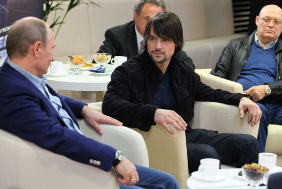 Vladimir Putin attends screening of film Legend No. 17