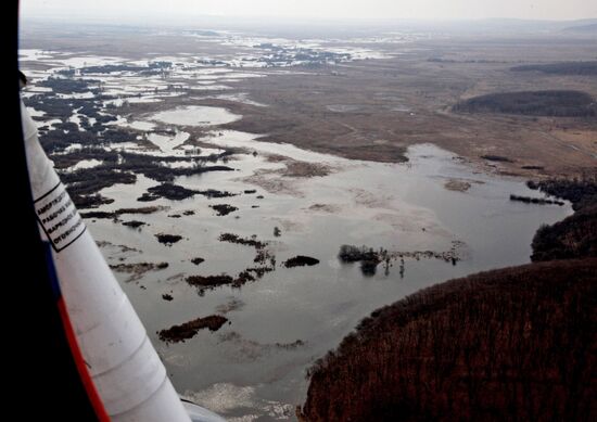 Rescue teams conduct aerial reconnaissance of flooded areas