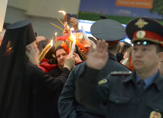 Meeting Holy Fire from Jerusalem at Vnukovo airport