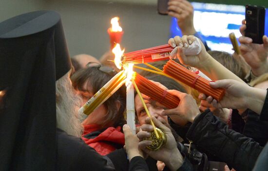 Meeting Holy Fire from Jerusalem at Vnukovo airport