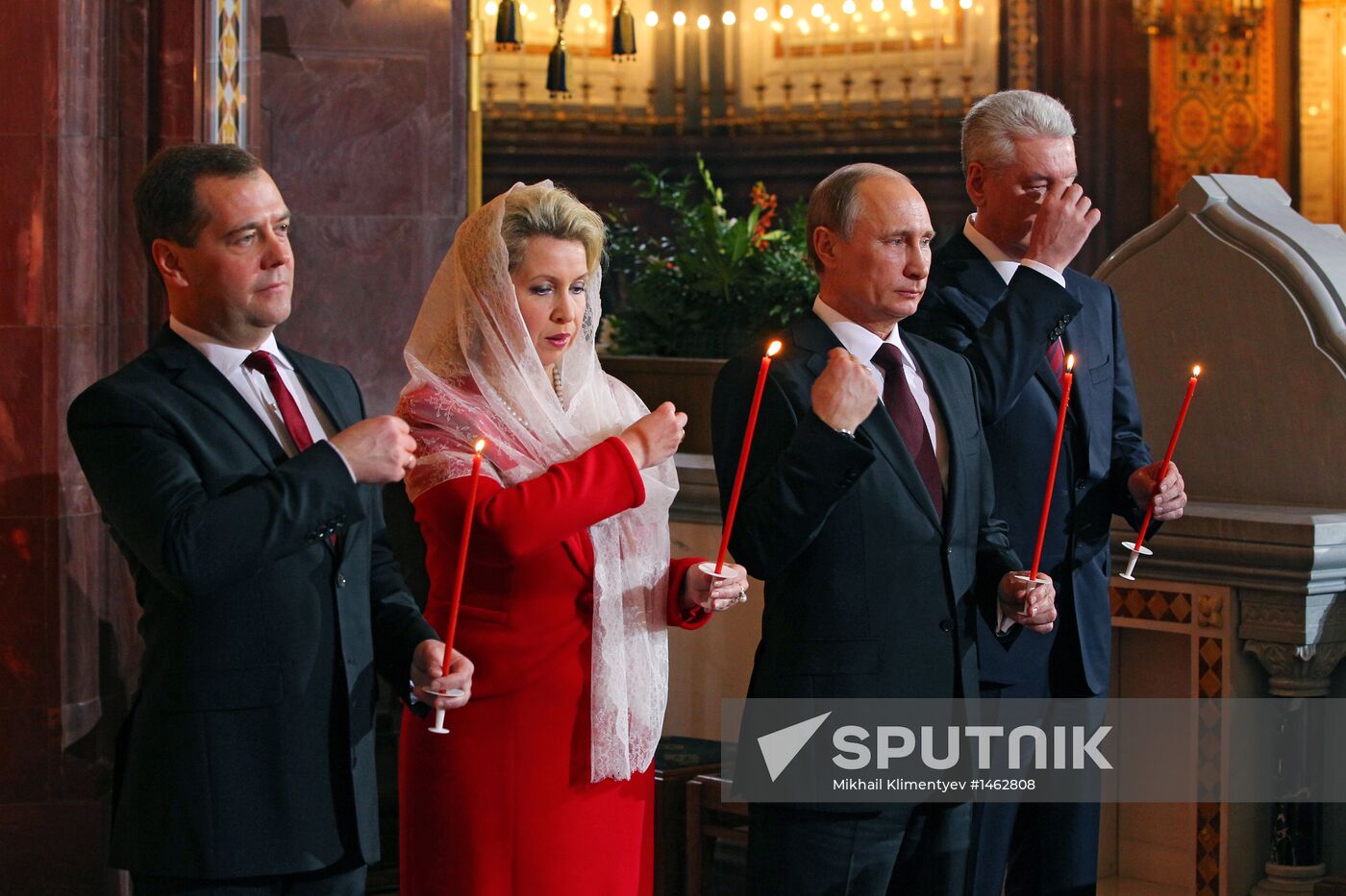 Vladimir Putin and Dmitry Medvedev attend Easter service