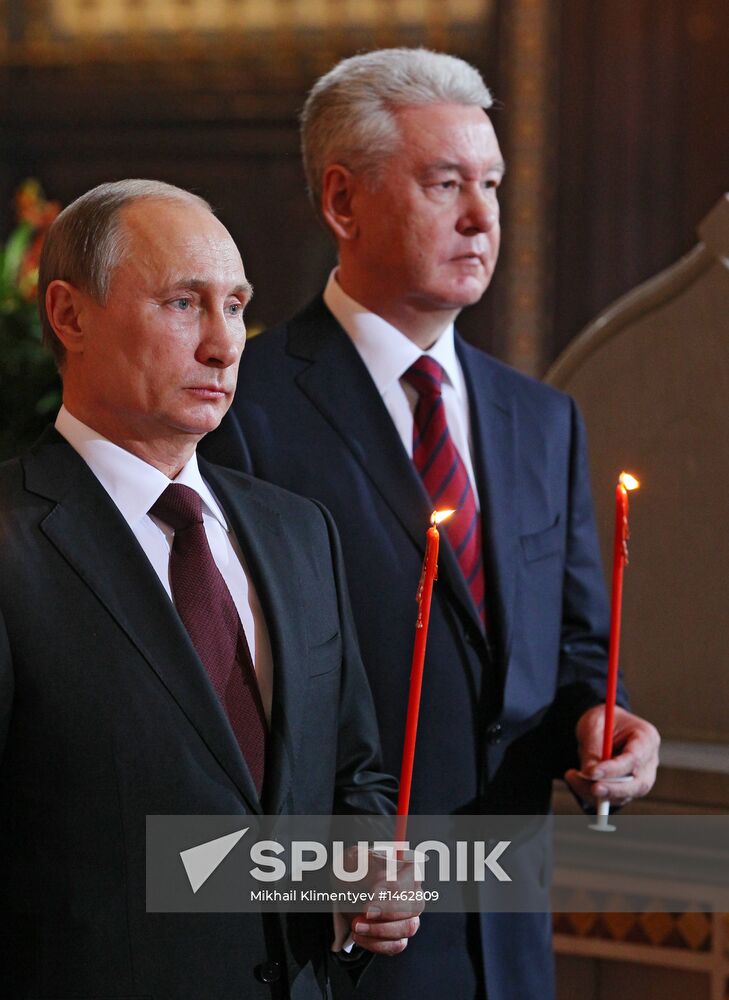 Vladimir Putin and Dmitry Medvedev attend Easter service