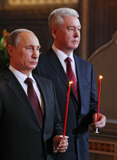 Vladimir Putin and Dmitry Medvedev attend Easter service