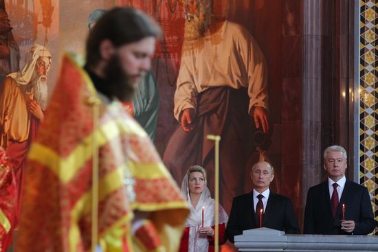 Vladimir Putin and Dmitry Medvedev attend Easter service
