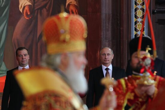 Vladimir Putin and Dmitry Medvedev attend Easter service