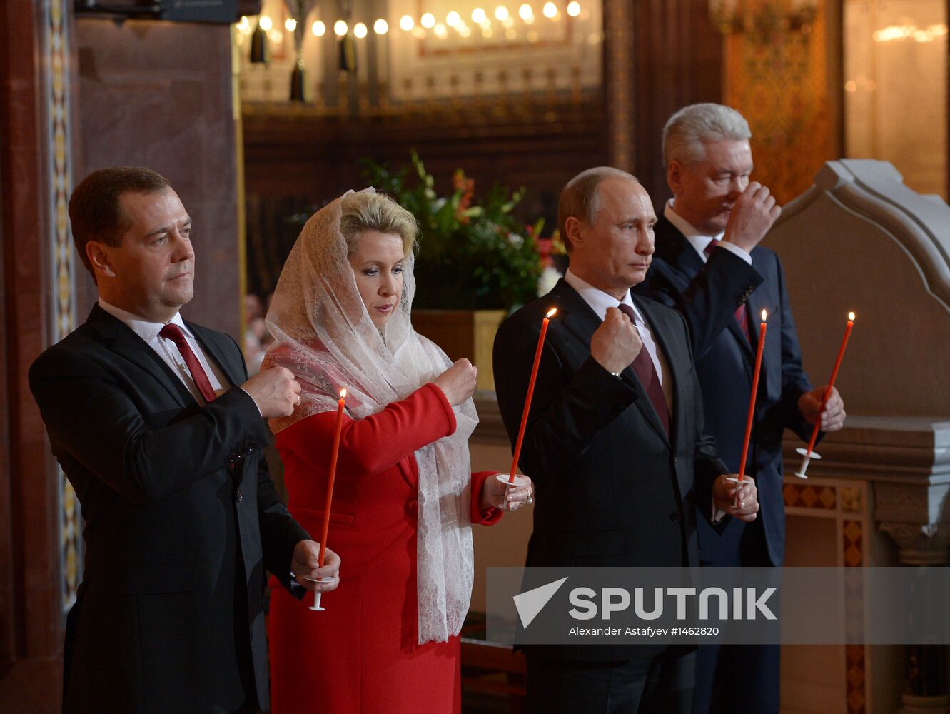 Vladimir Putin and Dmitry Medvedev attend Easter service