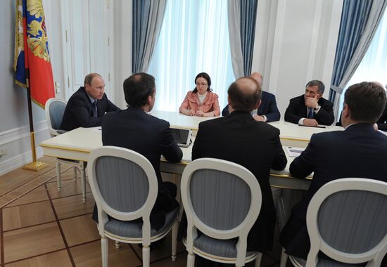 Russian President Vladimir Putin chairs a meeting