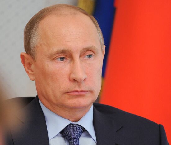 Russian President Vladimir Putin chairs a meeting