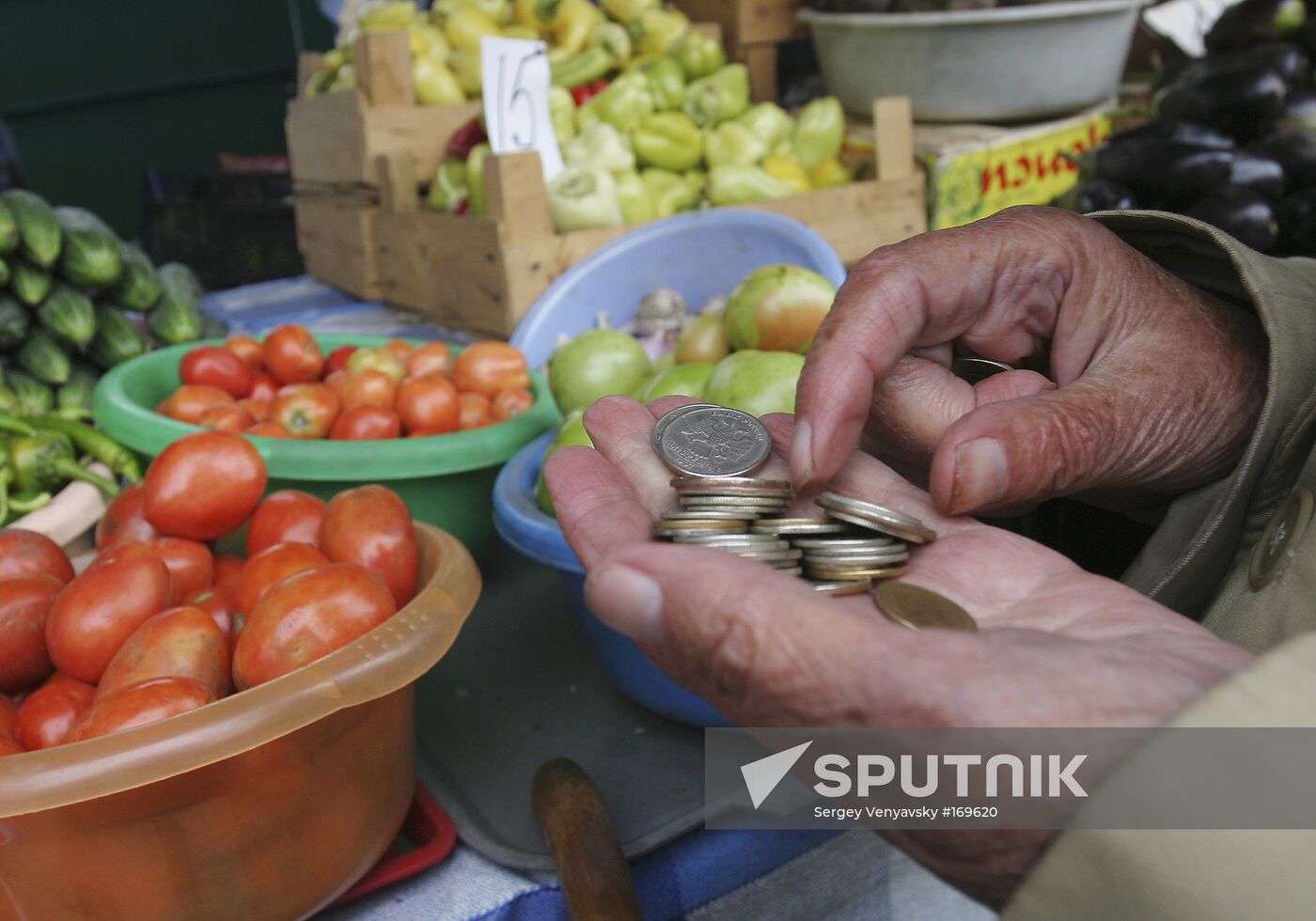Elderly people buying food at the market place