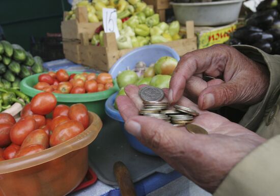 Elderly people buying food at the market place