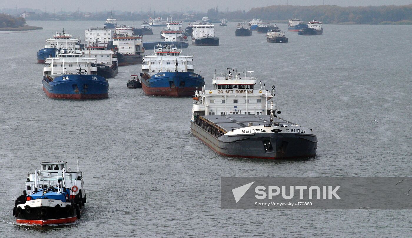 Tugs haul away grounded barges