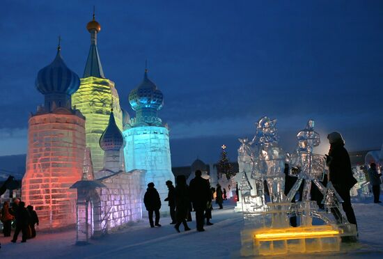 Ice village on an embankment of the Ob river 
