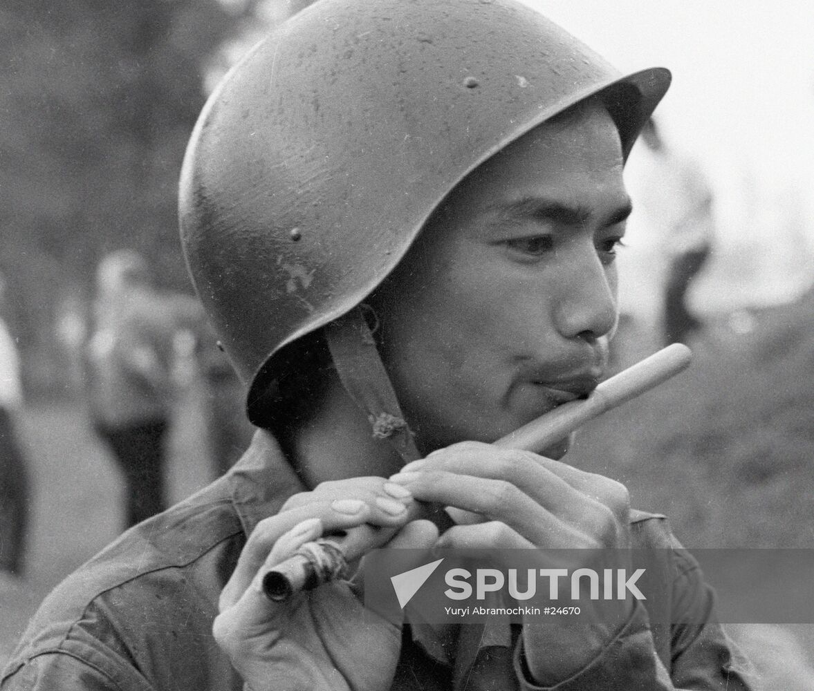 VIETNAM SOLDIER REED PIPE PLAYING