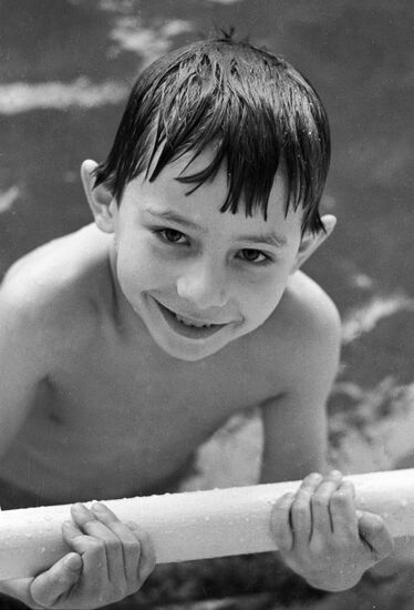 BOY WATER SKIING