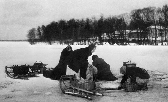 WOMAN ICE-HOLE LAUNDRY