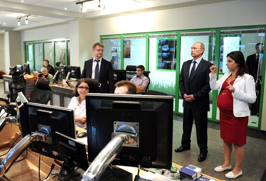 Vladimir Putin visits Russia Today television channel