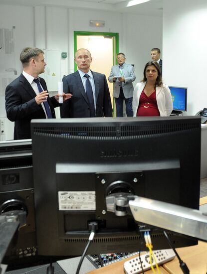 Vladimir Putin visits Russia Today television channel