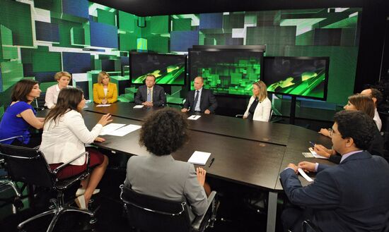 Vladimir Putin visits Russia Today television channel