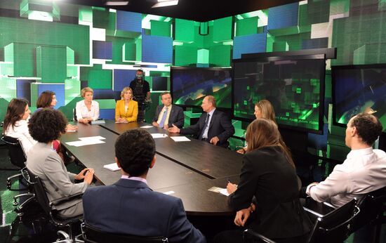 Vladimir Putin visits Russia Today television channel