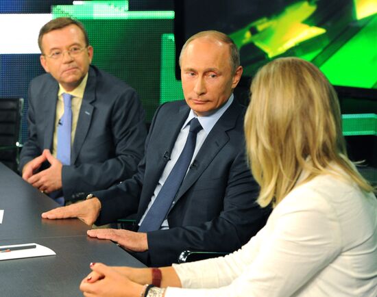 Vladimir Putin visits Russia Today television channel
