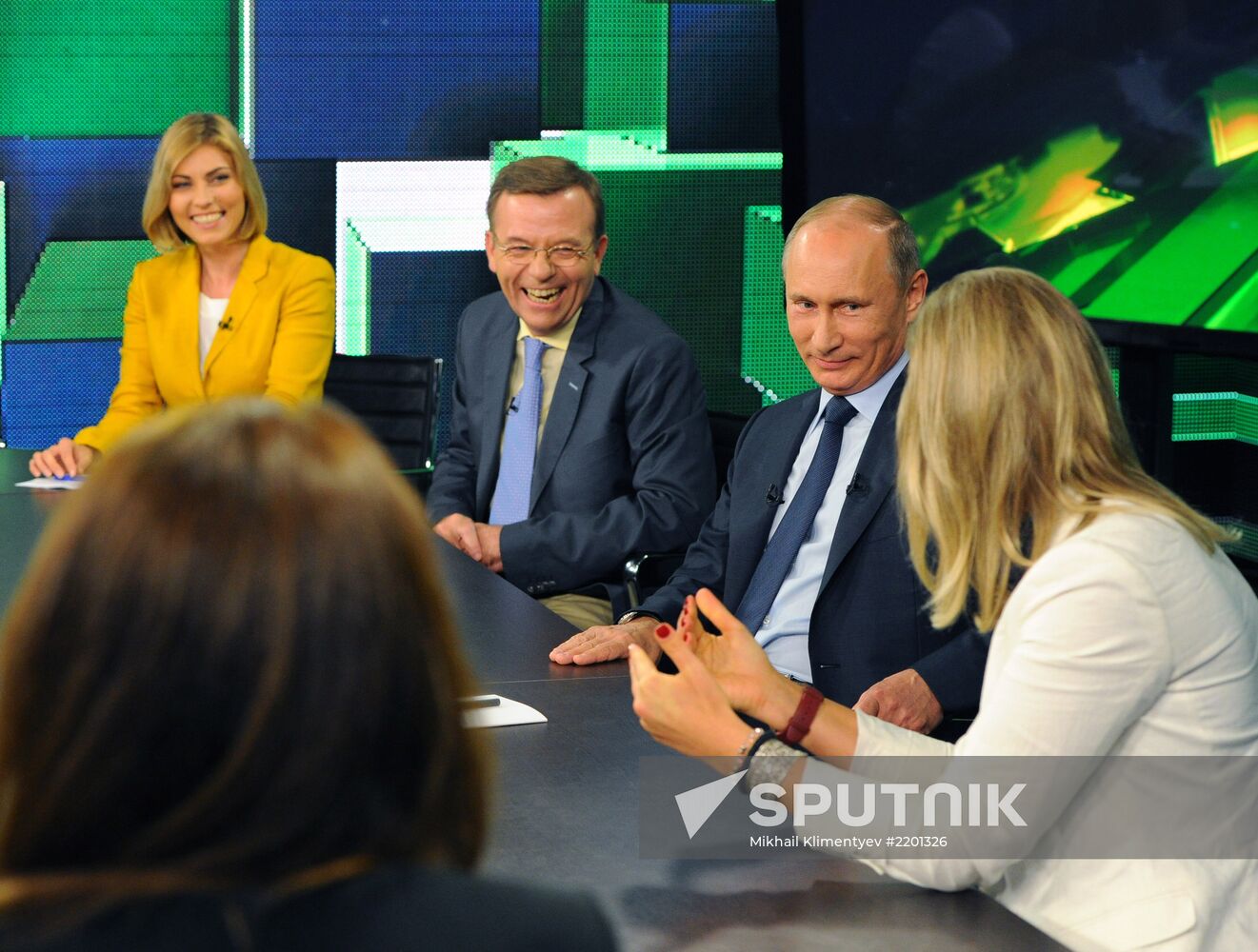 Vladimir Putin visits Russia Today television channel