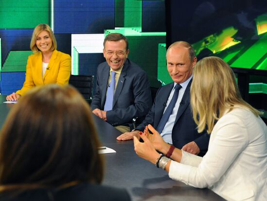 Vladimir Putin visits Russia Today television channel