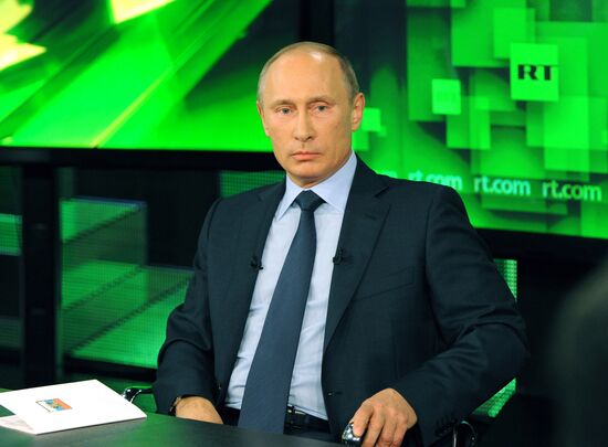 Vladimir Putin visits Russia Today television channel