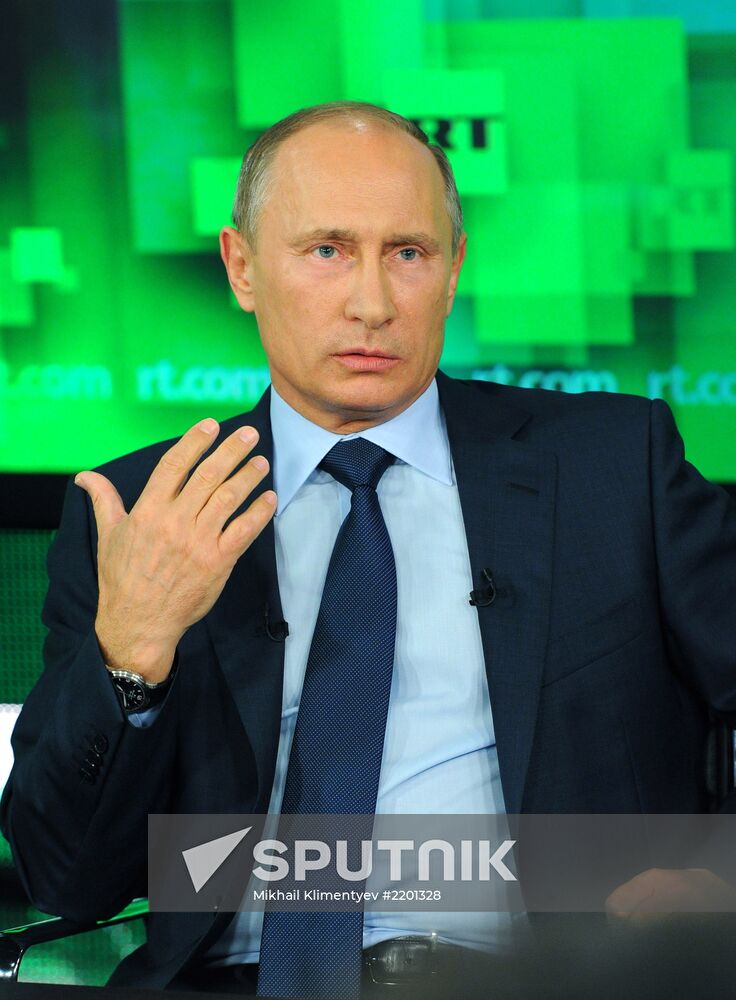 Vladimir Putin visits Russia Today television channel