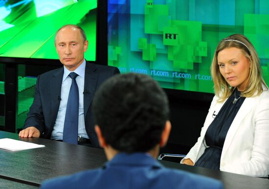 Vladimir Putin visits Russia Today television channel