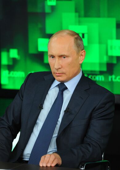 Vladimir Putin visits Russia Today television channel