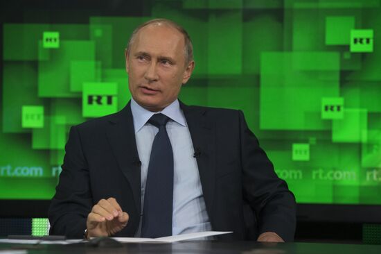 Vladimir Putin visits Russia Today television channel