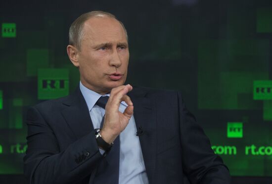 Vladimir Putin visits Russia Today television channel