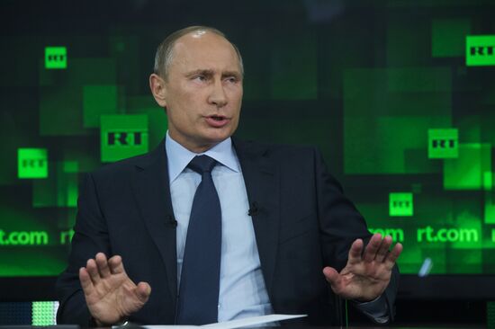 Vladimir Putin visits Russia Today television channel