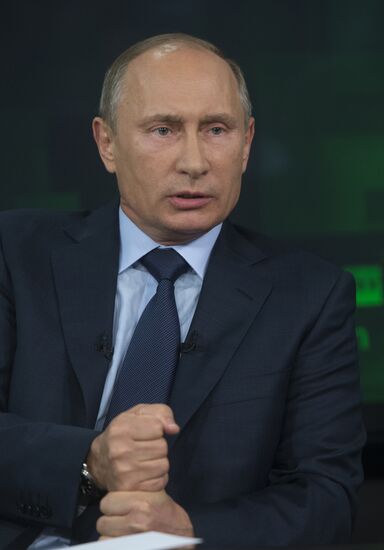 Vladimir Putin visits Russia Today television channel