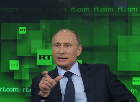 Vladimir Putin visits Russia Today television channel