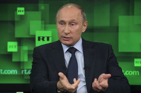 Vladimir Putin visits Russia Today television channel