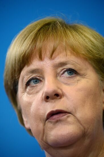 News conference of Vladimir Putin and Angela Merkel