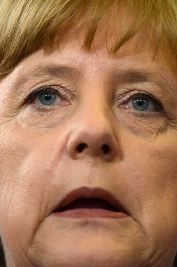 News conference of Vladimir Putin and Angela Merkel