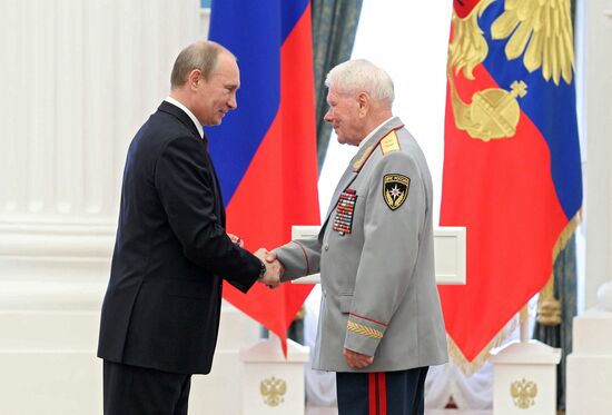 Vladimir Putin presents state awards