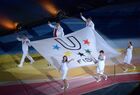 Actor Konstantin Khabensky, pianist Denis Matsuev, president of the Russian Swimming Federation Vladimir Salnikov (from left foreground), Bolshoi Thetre ballerina Svetlana Zakharova, Grandmaster Alisa Galliamova, gymnast Evgenia Kanayeva (from left background) carrying the FISU Flag at the opening ceremony of the 27th World Summer Universiade at Kazan Arena stadium in Kazan. Location: Russia, Republic of Tatarstan, Kazan. Author: Grigoriy Sokolov. Opening ceremony of 27th World Summer Universiade in Kazan