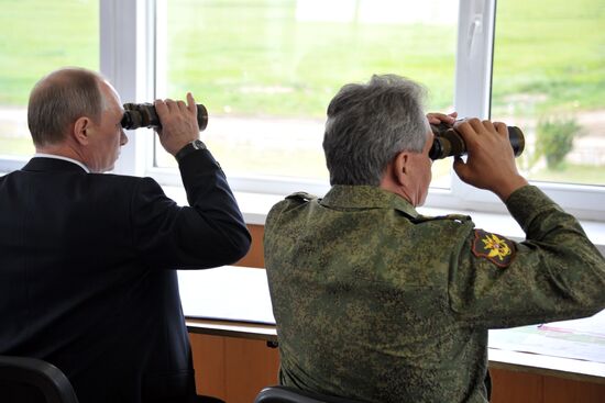 Vladimir Putin watches military exercise