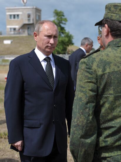 Vladimir Putin watches military exercise