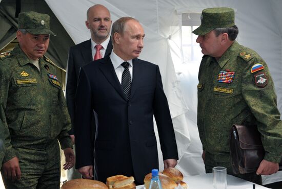 Vladimir Putin watches military exercise