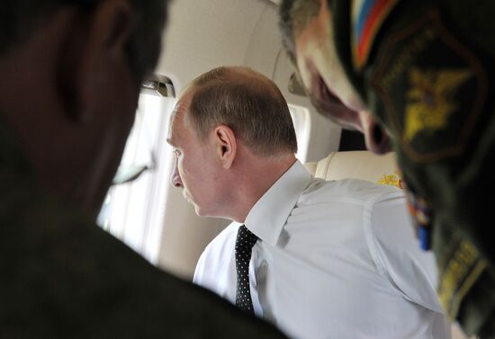 Vladimir Putin watches military exercise