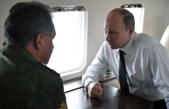 Vladimir Putin watches military exercise