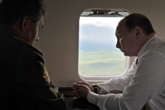 Vladimir Putin watches military exercise