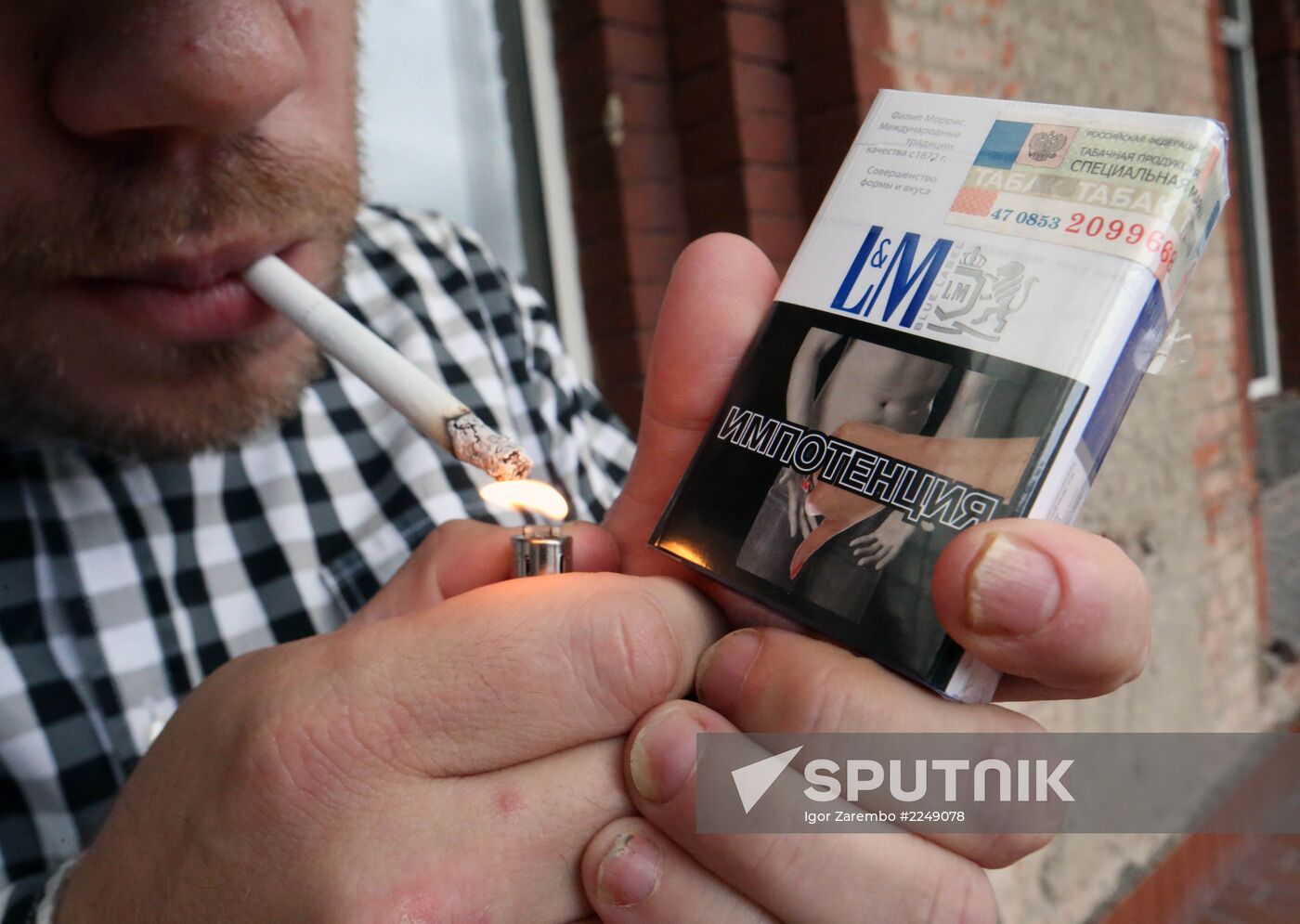 Cigarette packs with pictures warning of smoking consequences