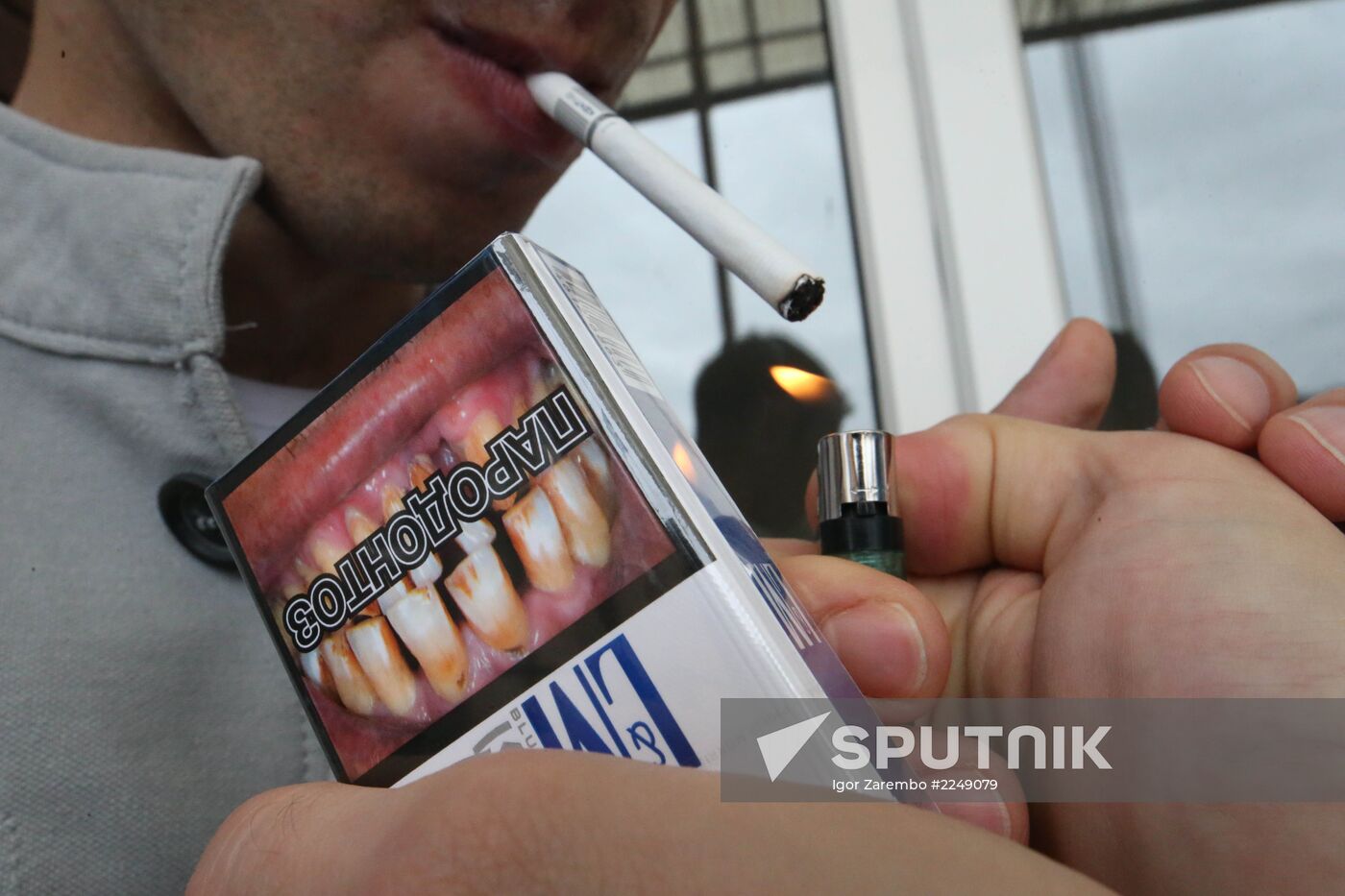 Cigarette packs with pictures warning of smoking consequences