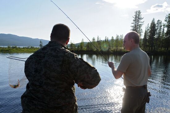 Vladimir Putin and Dmitry Medvedev on holiday