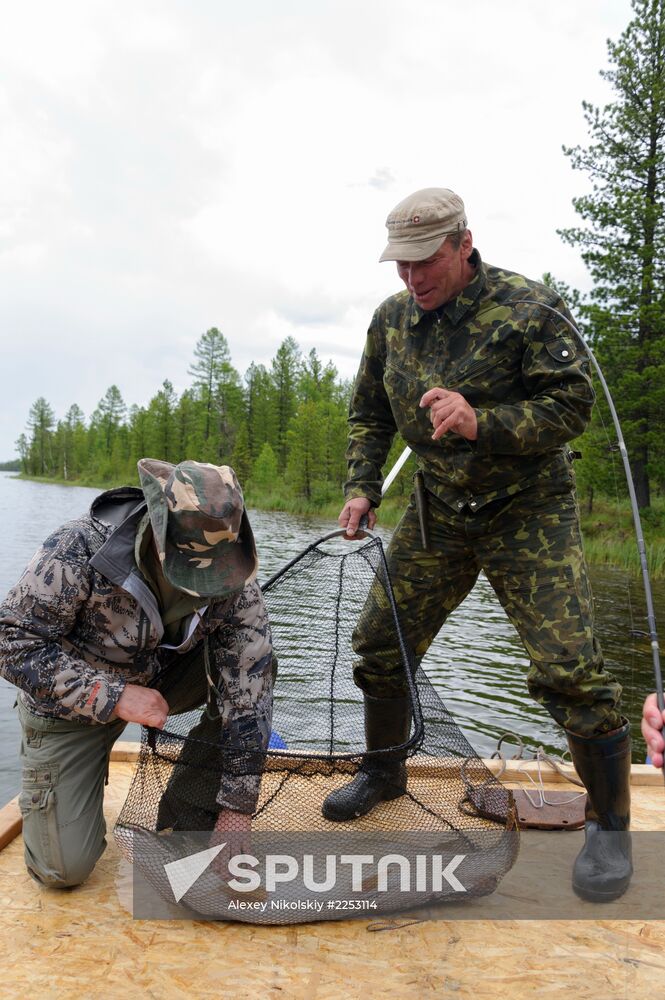 Vladimir Putin and Dmitry Medvedev on holiday